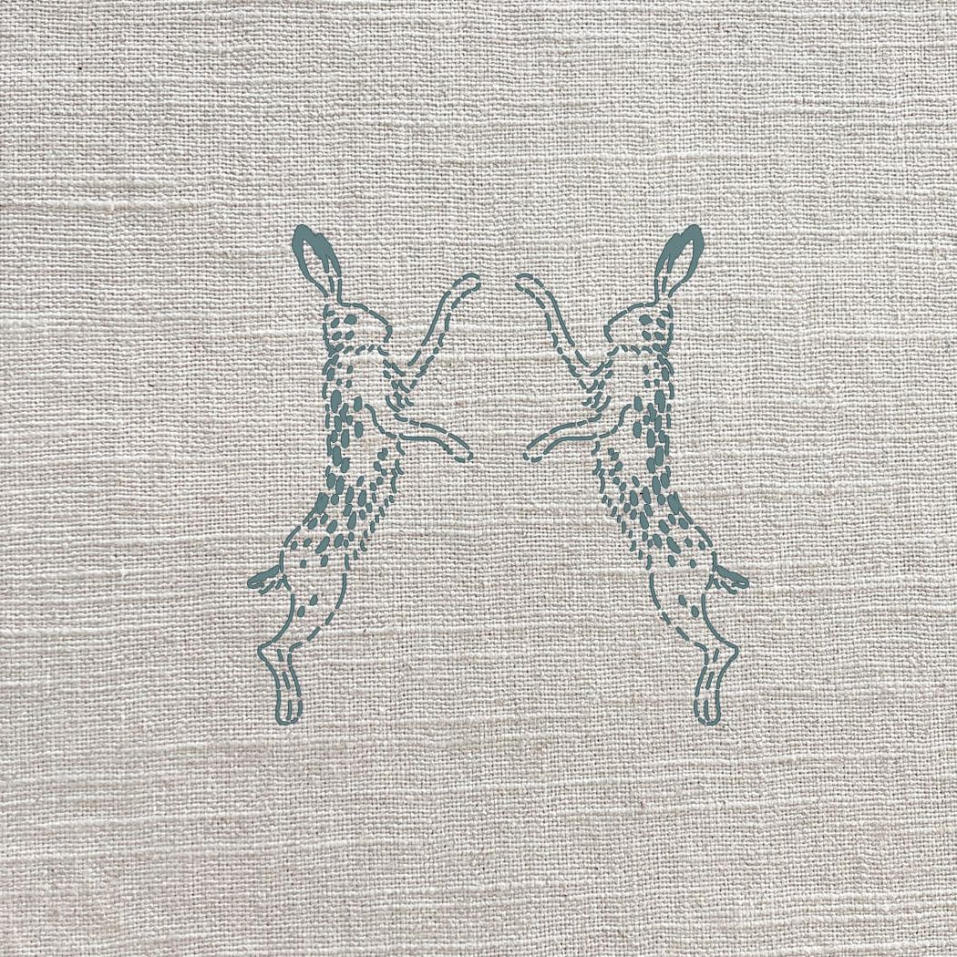 Boxing Hares Duck Egg Linen Fabric by Sophie Allport